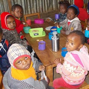 baby class taking porridge for breakfast